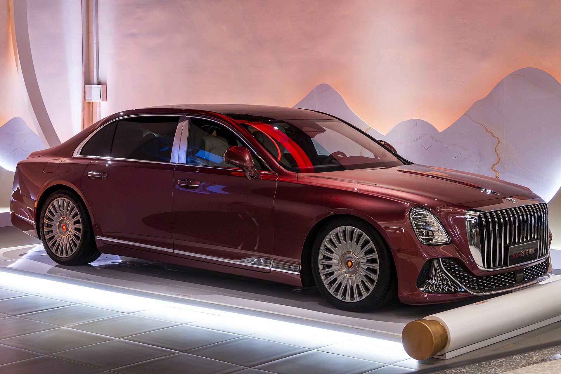 Burgundy Hongqi Guoya flagship saloon in a refined display setting